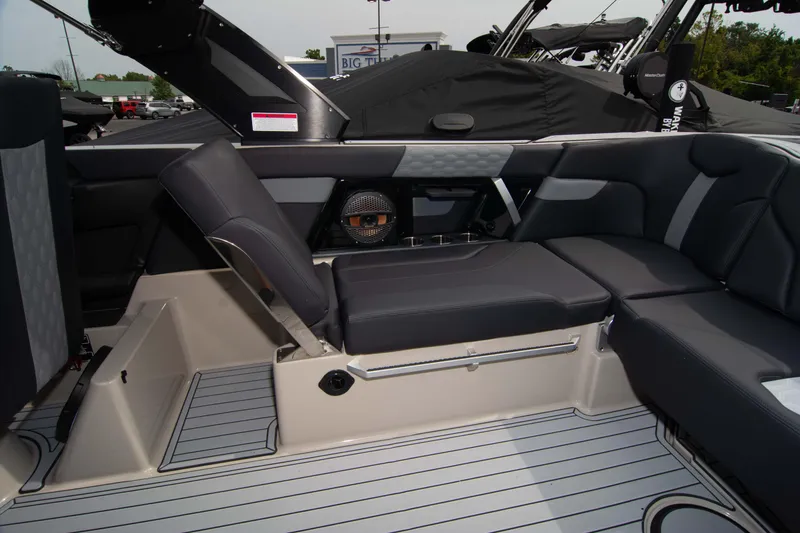 Slide: The Image of 2025 MasterCraft XT24 boat interior with sleek seating and modern design. - 18