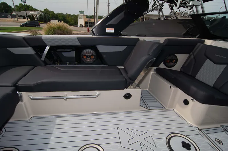 Slide: The Image of 2025 MasterCraft XT24 boat interior with sleek seating and modern design. - 20