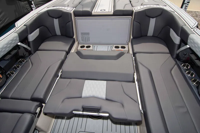Slide: The Image of 2025 MasterCraft XT24 boat interior with luxurious gray seating and sleek design. - 24