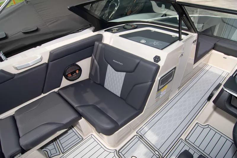 Slide: The Image of 2025 MasterCraft XT24 boat interior with sleek seating and modern design. - 42