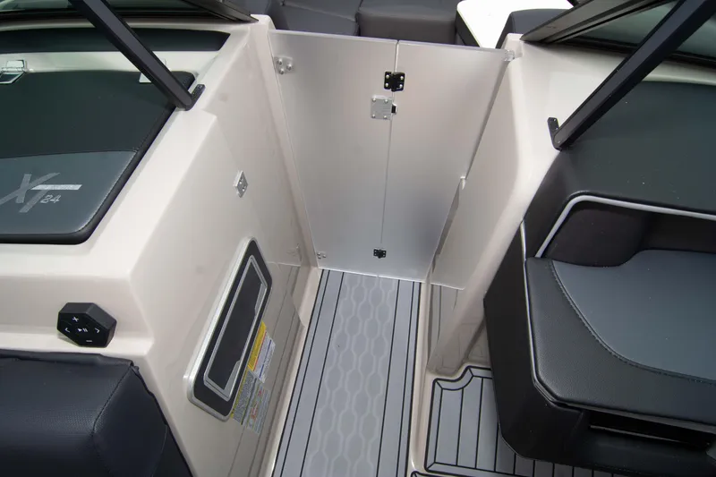 Slide: The Image of 2025 MasterCraft XT24 boat interior with sleek seating and modern design. - 44