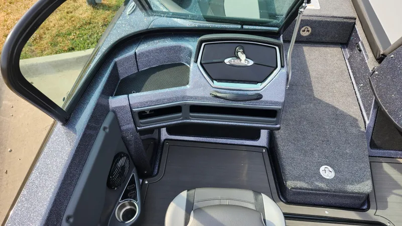 Slide: The Image of 2025 Lund 189 Tyee GL boat interior, featuring sleek seating and modern dashboard design. - 11