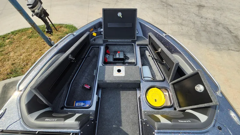 Slide: The Image of 2025 Lund 189 Tyee GL boat interior with open storage compartments. - 14
