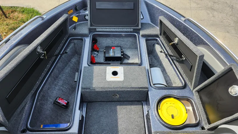 Slide: The Image of 2025 Lund 189 Tyee GL boat interior with storage compartments and equipment. - 16