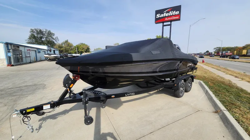 Slide: The Image of 2025 Lund 189 Tyee GL boat on trailer, covered, parked outdoors. - 19