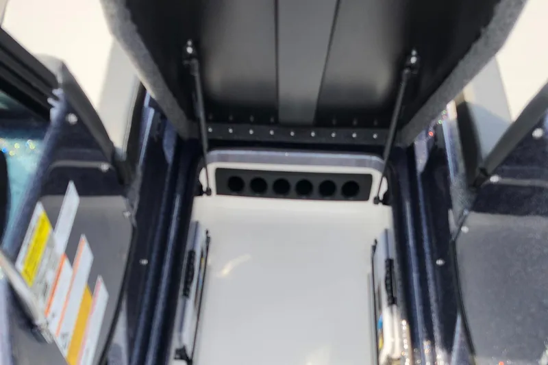 Slide: The Image of Interior view of 2025 Lund 189 Tyee GL boat, showcasing storage compartments. - 25
