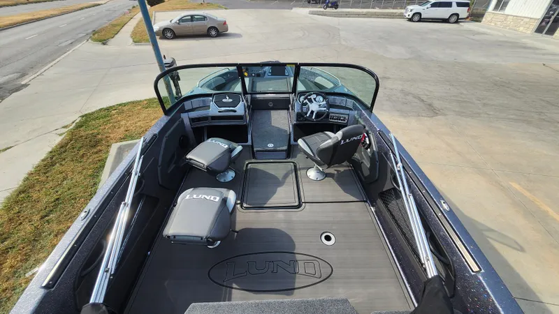 Slide: The Image of 2025 Lund 189 Tyee GL boat interior with seating and steering wheel. - 6