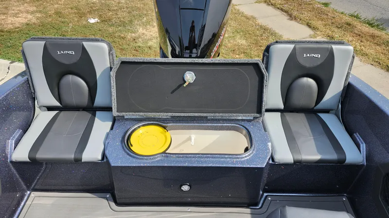 Slide: The Image of 2025 Lund 189 Tyee GL boat interior with seating and storage compartment. - 8