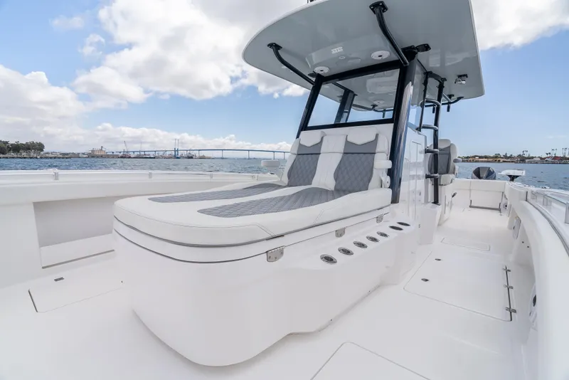Slide: The Image of 2020 Invincible 35 Catamaran with sleek design, spacious deck, and modern seating on open water. - 10