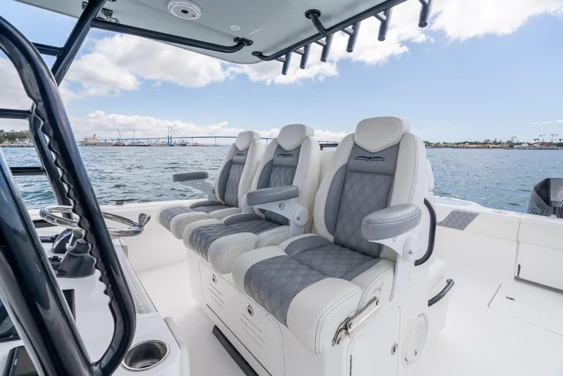 Slide: The Image of Invincible 35 Catamaran 2020 interior with luxurious seating on open water. - 12