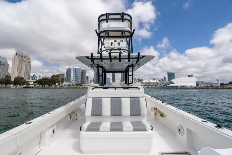 Slide: The Image of 2020 Invincible 35 Catamaran on water, city skyline in background. - 15