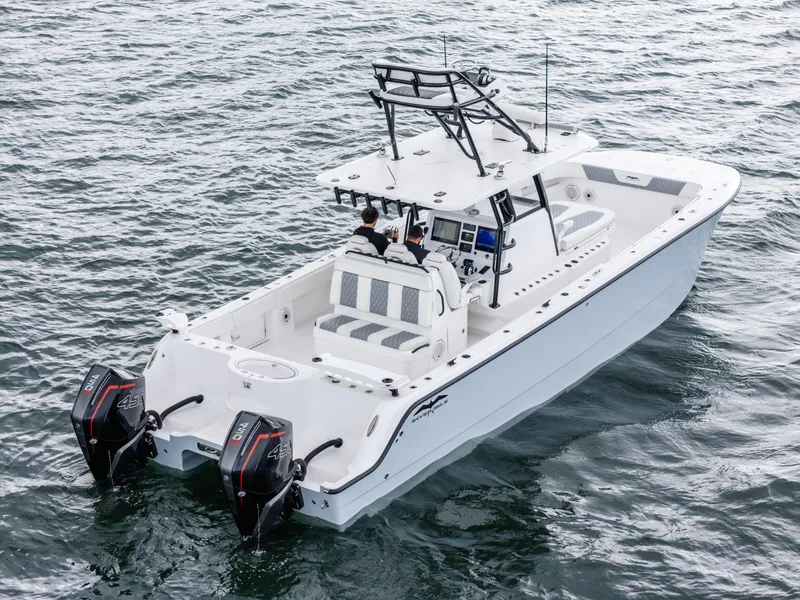 Slide: The Image of 2020 Invincible 35 Catamaran on water, featuring dual engines and spacious deck. - 6