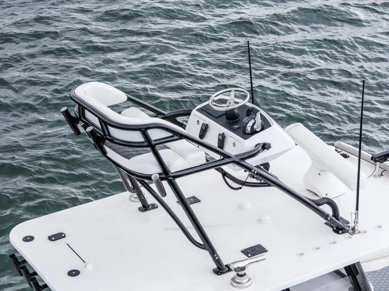 Slide: The Image of 2020 Invincible 35 Catamaran helm on open water, featuring sleek design and controls. - 7