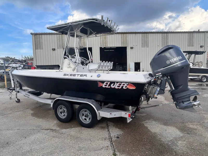Slide: The Image of 2013 Skeeter SX2250 boat with Yamaha outboard motor on a trailer. - 3