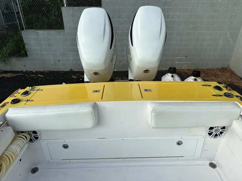 Slide: The Image of 1988 Wellcraft SCARAB SPORT boat with dual engines and yellow deck. - 10