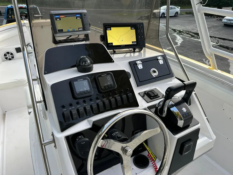 Slide: The Image of 1988 Wellcraft SCARAB SPORT boat dashboard with modern navigation equipment and controls. - 16
