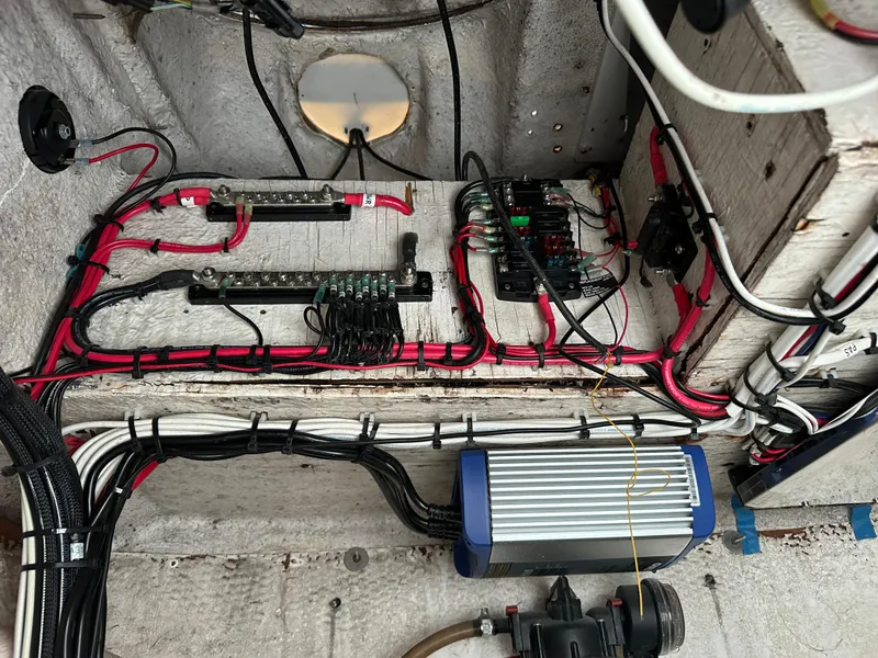 Slide: The Image of 1988 Wellcraft SCARAB SPORT boat wiring and electrical components in engine compartment. - 26