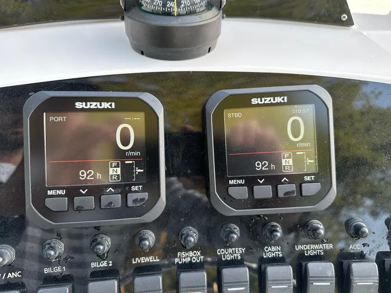 Slide: The Image of Dashboard of a 1988 Wellcraft SCARAB SPORT boat with Suzuki engine displays. - 31