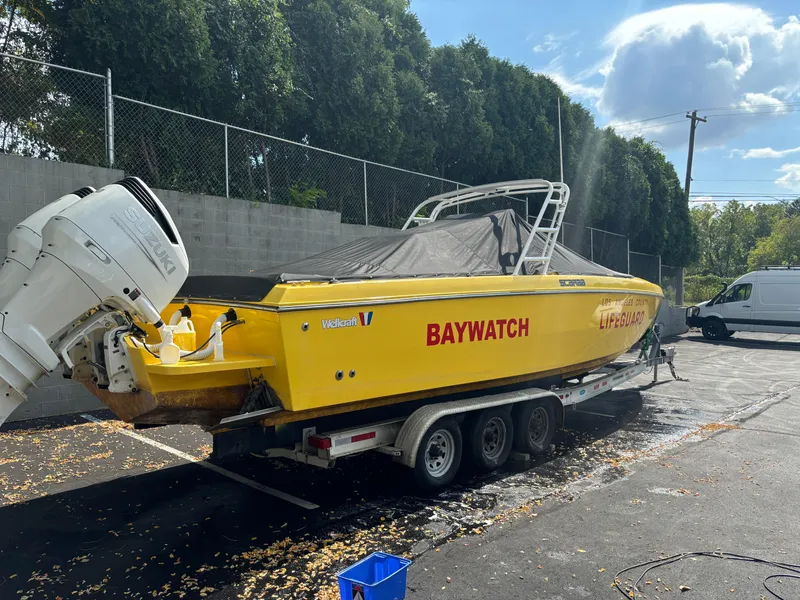 Slide: The Image of 1988 Wellcraft SCARAB SPORT boat, yellow, on trailer, labeled "Baywatch" and "Lifeguard." - 7