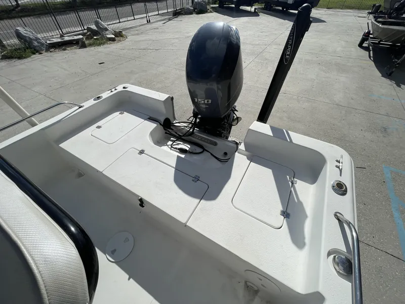 Slide: The Image of 2005 Sea Pro SV2100 boat with 150 HP outboard motor, docked on concrete. - 16