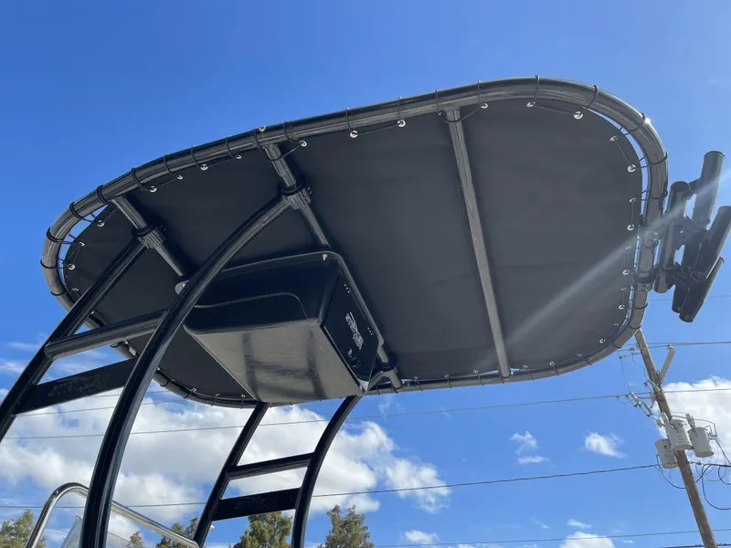 Slide: The Image of 2005 Sea Pro SV2100 boat T-top against blue sky. - 22