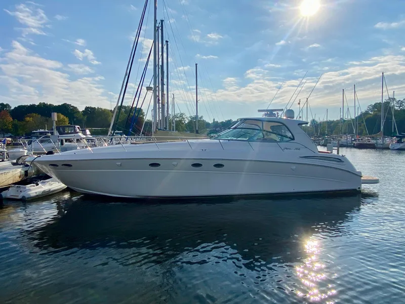 Slide: The Image of 2001 Sea Ray 510 Sundancer yacht docked in sunny marina. - 16