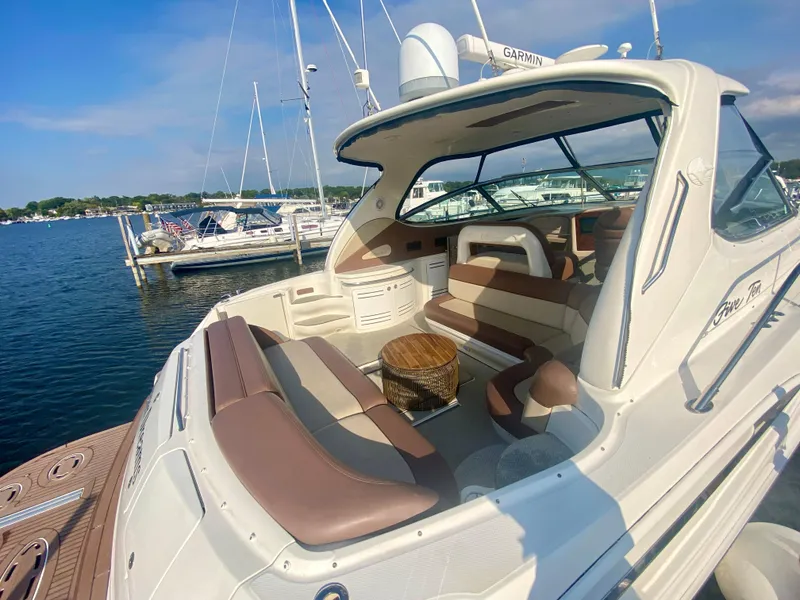 Slide: The Image of 2001 Sea Ray 510 Sundancer yacht with spacious seating, docked at marina. - 22