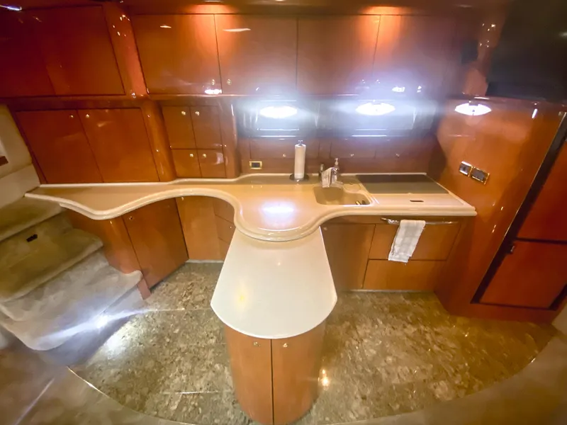 Slide: The Image of Luxurious kitchen interior of 2001 Sea Ray 510 Sundancer yacht with sleek cabinetry. - 46