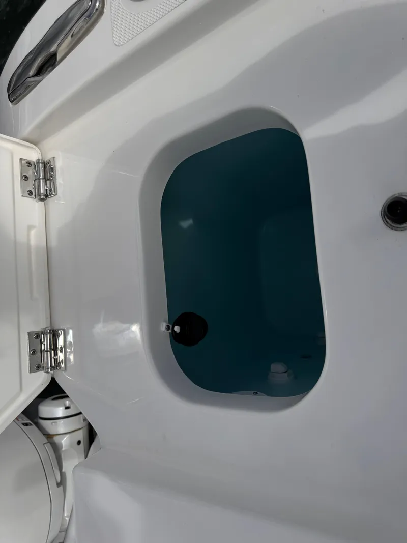 Slide: The Image of 2023 Pursuit S 328 Sport boat livewell with open lid. - 23