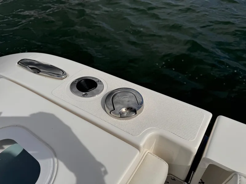 Slide: The Image of 2023 Pursuit S 328 Sport boat deck detail with water in background. - 24