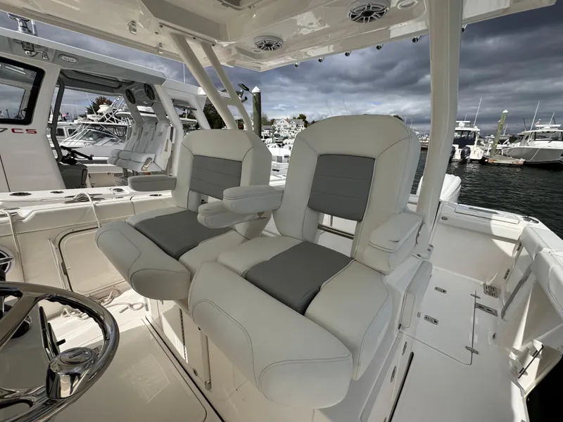 Slide: The Image of 2023 Pursuit S 328 Sport boat interior with luxurious seating and modern design. - 28