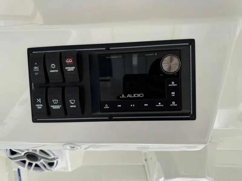 Slide: The Image of Control panel of 2023 Pursuit S 328 Sport boat with JL Audio system. - 37