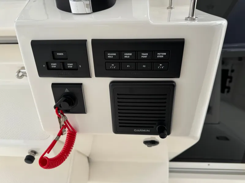 Slide: The Image of Control panel of 2023 Pursuit S 328 Sport boat with Garmin system. - 38