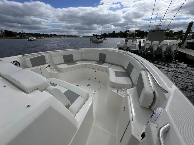 Slide: The Image of 2023 Pursuit S 328 Sport boat with spacious seating on a calm waterfront. - 39