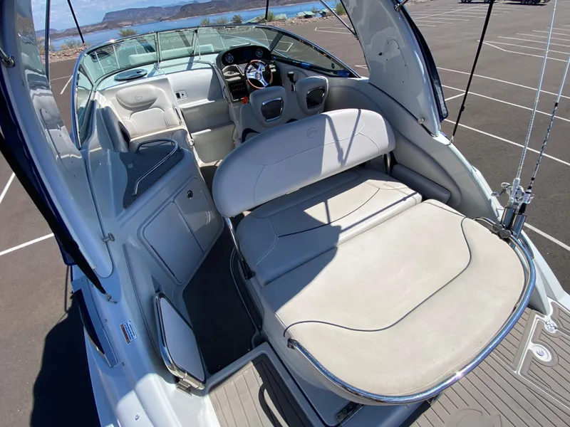 Slide: The Image of 2022 Crownline 264 CR boat interior with spacious seating and modern dashboard. - 12