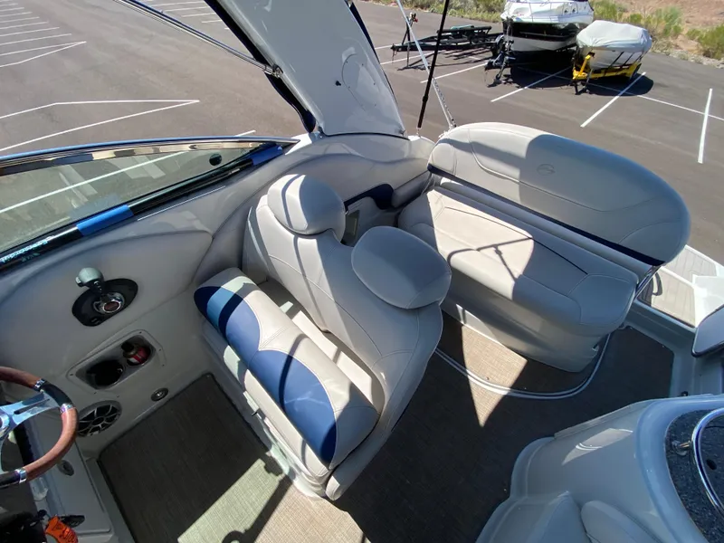 Slide: The Image of 2022 Crownline 264 CR boat interior with plush seating and modern design. - 16