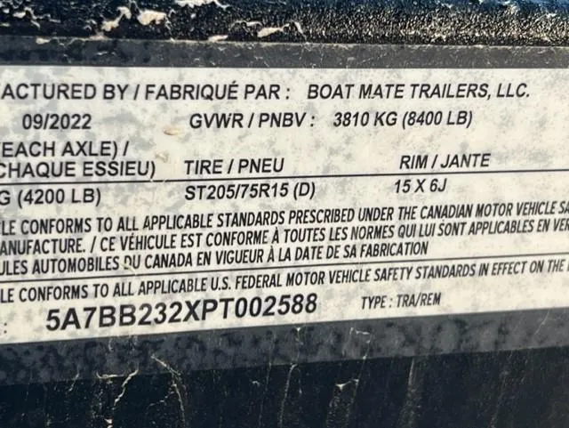 Slide: The Image of Boat Mate Trailers label, GVWR 3810 kg, tire ST205/75R15, rim 15x6J, manufactured  - 18