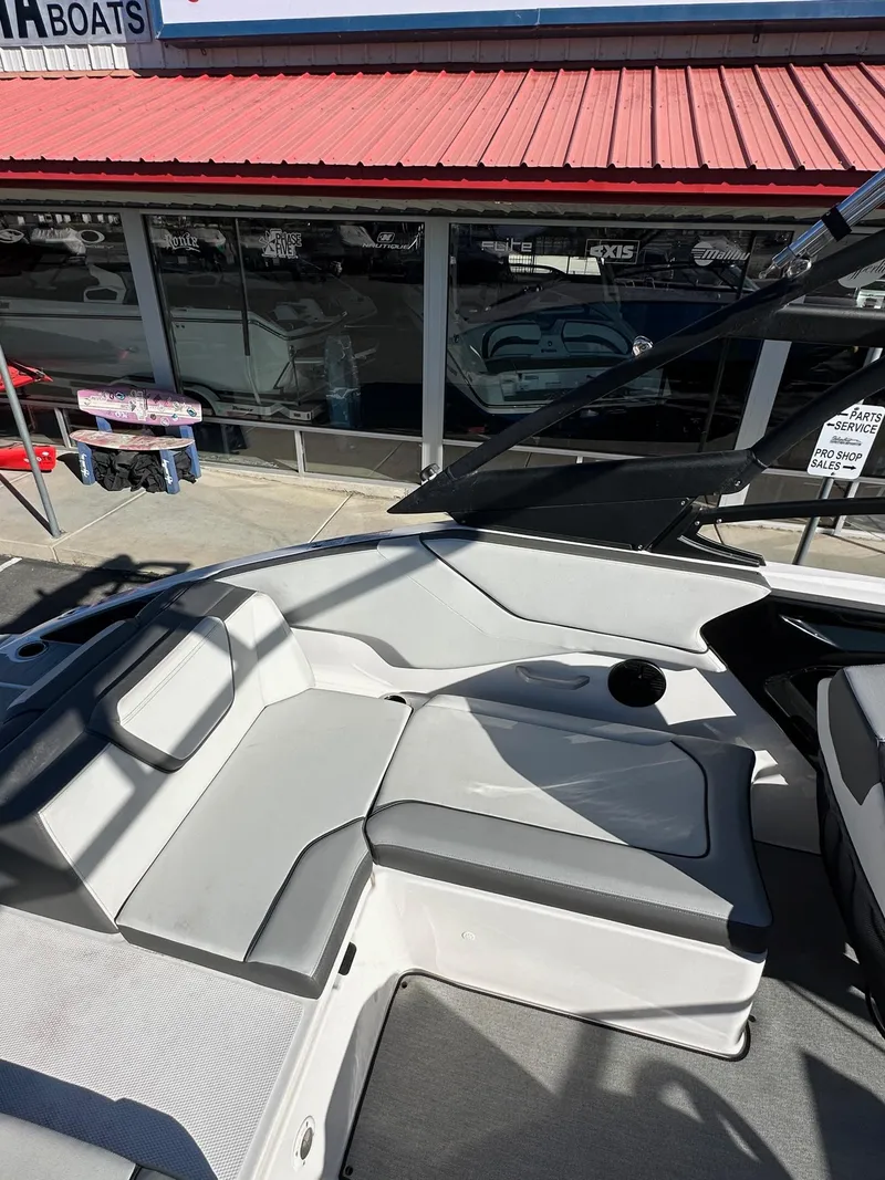 Slide: The Image of 2023 Yamaha AR250 jet boat interior with gray seating and modern design. - 11