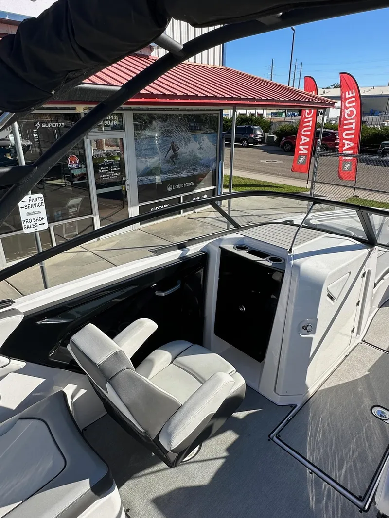 Slide: The Image of 2023 Yamaha AR250 jet boat interior with seating and dashboard view. - 12