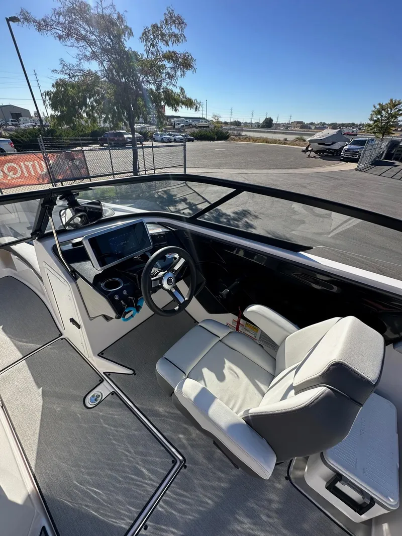 Slide: The Image of 2023 Yamaha AR250 jet boat interior with steering wheel and dashboard display. - 15