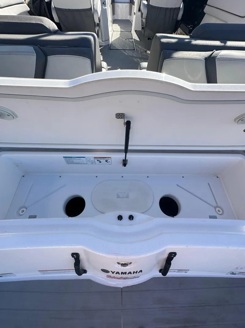 Slide: The Image of 2023 Yamaha AR250 jet boat interior with seating and storage compartment. - 21