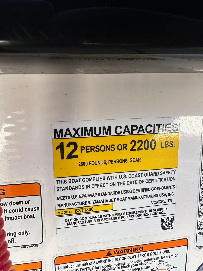 Slide: The Image of Capacity label for 2023 Yamaha AR250 jet boat, max 12 persons or 2200 lbs. - 23