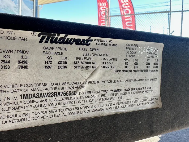 Slide: The Image of Label on a 2023 Yamaha AR250 jet boat trailer, detailing weight and tire specifications. - 25