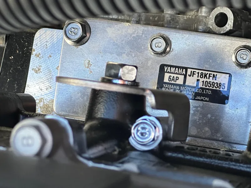 Slide: The Image of Close-up of 2023 Yamaha AR250 engine plate with model details and serial number. - 26