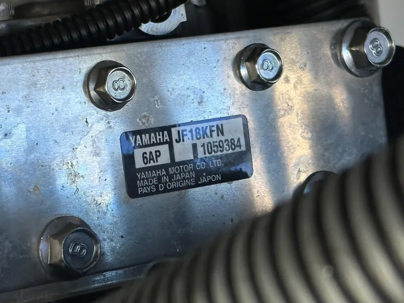 Slide: The Image of Close-up of Yamaha AR250 engine plate, showing model and serial number details. - 27