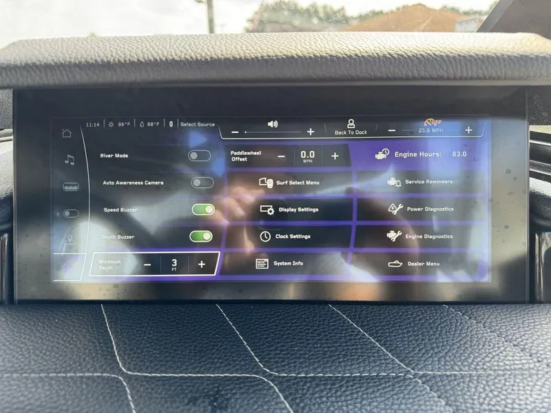 Slide: The Image of 2023 Nautique Super Air Nautique G23 touchscreen display with various boat settings and diagnostics. - 12