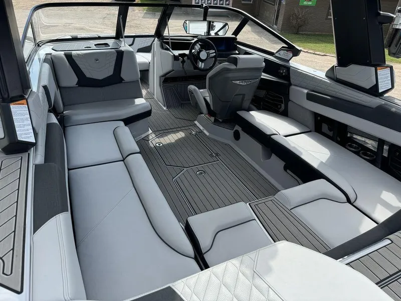 Slide: The Image of Interior of 2023 Nautique Super Air Nautique G23 boat, featuring sleek seating and modern design. - 2