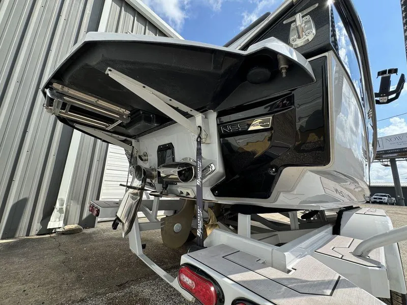 Slide: The Image of 2023 Nautique Super Air Nautique G23 boat rear view, showcasing propeller and NSS system. - 7
