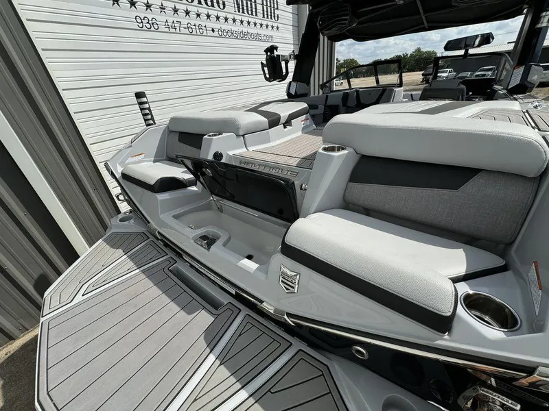 Slide: The Image of 2023 Nautique Super Air Nautique G23 boat interior with sleek seating and modern design. - 8