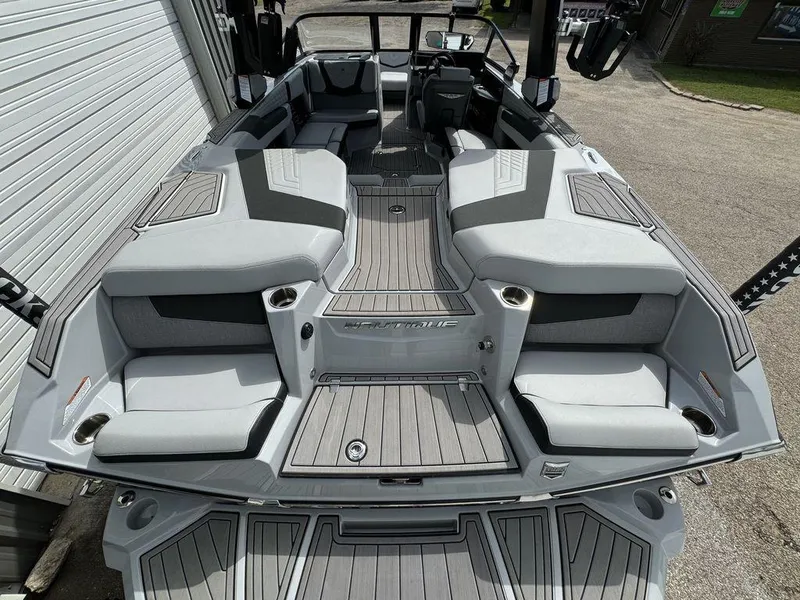 Slide: The Image of 2023 Nautique Super Air Nautique G23 boat interior with sleek seating and modern design. - 9